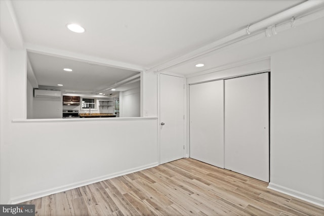 1425 Webster St NW, Washington, DC 20011 - interior space with a wall mounted AC, wood finished floors, and recessed lighting