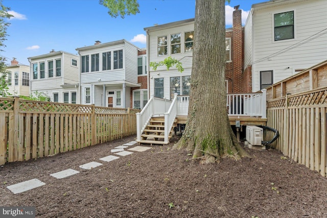 1425 Webster St NW, Washington, DC 20011 - back of property featuring a deck, a fenced backyard, and stairs