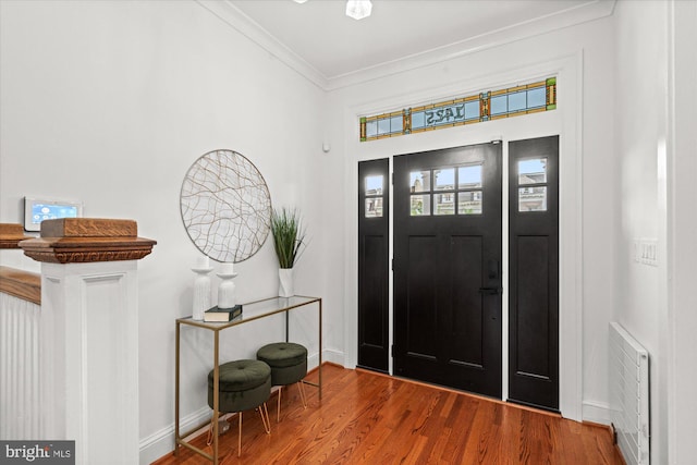 1425 Webster St NW, Washington, DC 20011 - foyer featuring crown molding, wood finished floors, and heating unit
