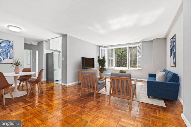 4100 W St NW Unit 306, Washington, DC 20007 - living room featuring baseboards