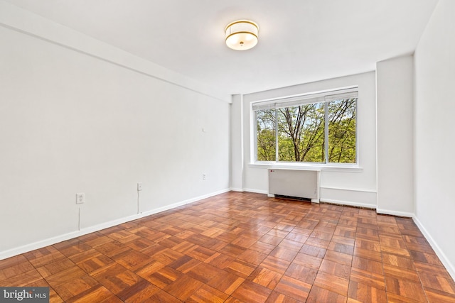 4100 W St NW Unit 306, Washington, DC 20007 - unfurnished room with radiator heating unit and baseboards