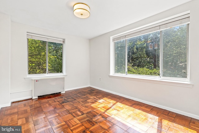 4100 W St NW Unit 306, Washington, DC 20007 - unfurnished room featuring healthy amount of natural light and radiator heating unit
