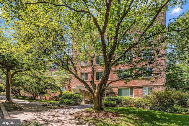 4100 W St NW Unit 306, Washington, DC 20007 - view of front facade with brick siding and a front yard