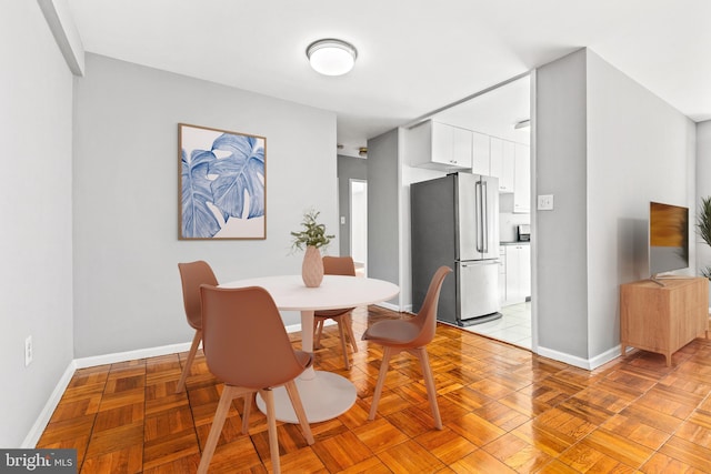 4100 W St NW Unit 306, Washington, DC 20007 - dining space with baseboards