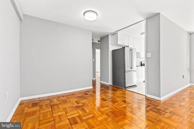 4100 W St NW Unit 306, Washington, DC 20007 - kitchen featuring freestanding refrigerator and white cabinetry