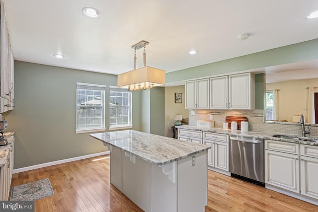 8535 Dark Hawk Cir, Columbia, MD 21045 - kitchen with stainless steel dishwasher, tasteful backsplash, a kitchen island, light wood-type flooring, and recessed lighting