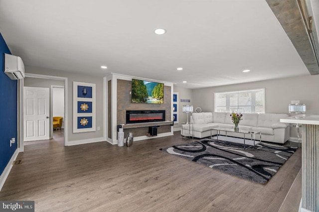 1039 Clinton Ave, Bensalem, PA 19020 - living area featuring a wall unit AC, wood finished floors, a fireplace, and recessed lighting