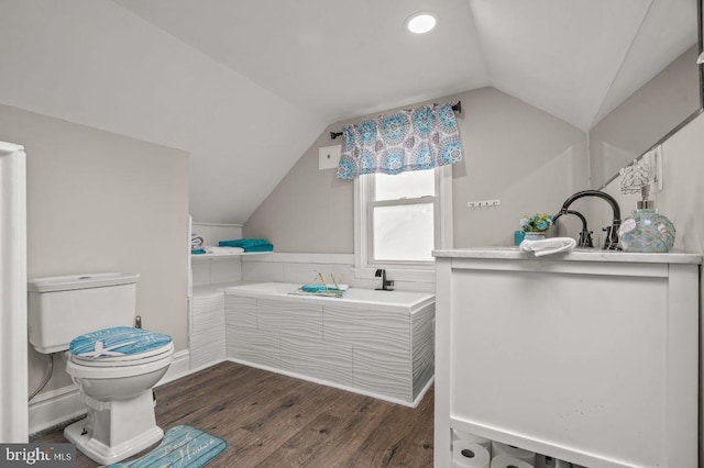 1039 Clinton Ave, Bensalem, PA 19020 - bathroom featuring vaulted ceiling, wood finished floors, and a bath
