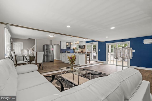 1039 Clinton Ave, Bensalem, PA 19020 - living room with dark wood-type flooring, recessed lighting, and a wall mounted AC
