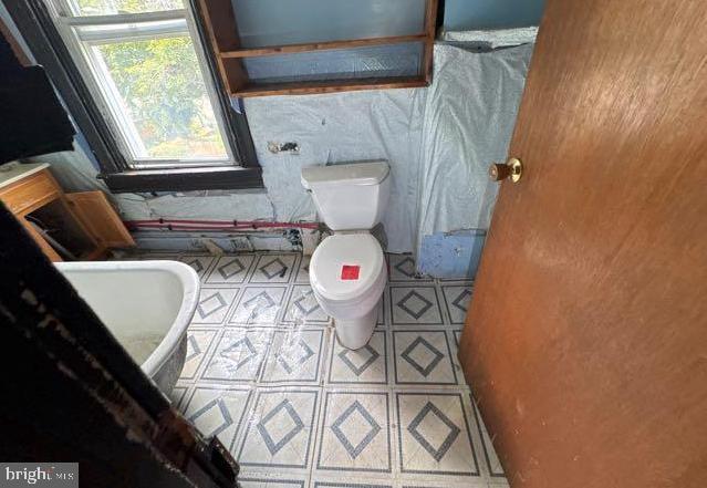 324 Fulton Ave, Baltimore, MD 21223 - bathroom with toilet and tile patterned floors