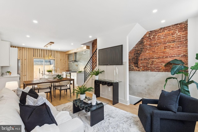 2165 E Gordon St, Philadelphia, PA 19125 - living room with recessed lighting, light wood-style flooring, and brick wall