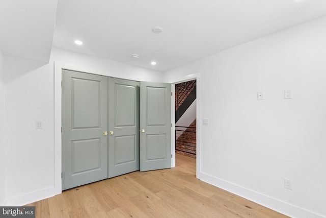 2165 E Gordon St, Philadelphia, PA 19125 - unfurnished bedroom with light wood-style flooring, a closet, and recessed lighting