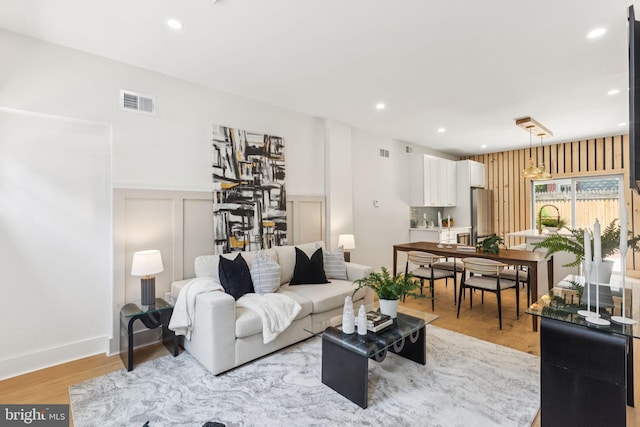 2165 E Gordon St, Philadelphia, PA 19125 - living area featuring recessed lighting, light wood finished floors, a decorative wall, and wainscoting