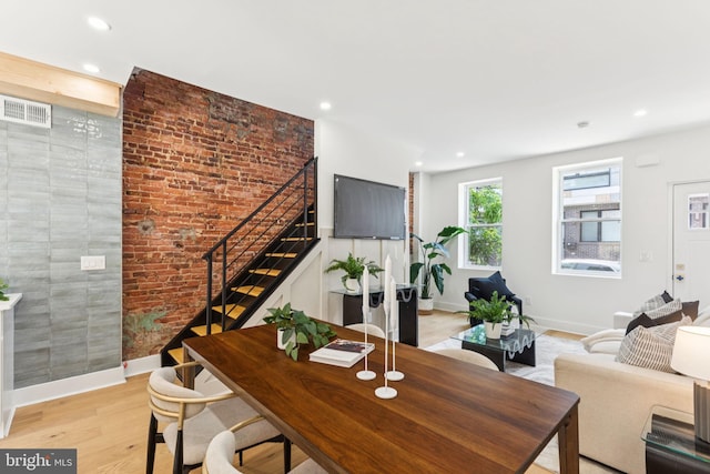 2165 E Gordon St, Philadelphia, PA 19125 - living room featuring stairway, recessed lighting, light wood-style flooring, and brick wall