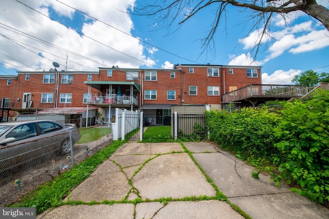 5563 Cedonia Ave, Baltimore, MD 21206 - rear view of house with a gate and a fenced front yard