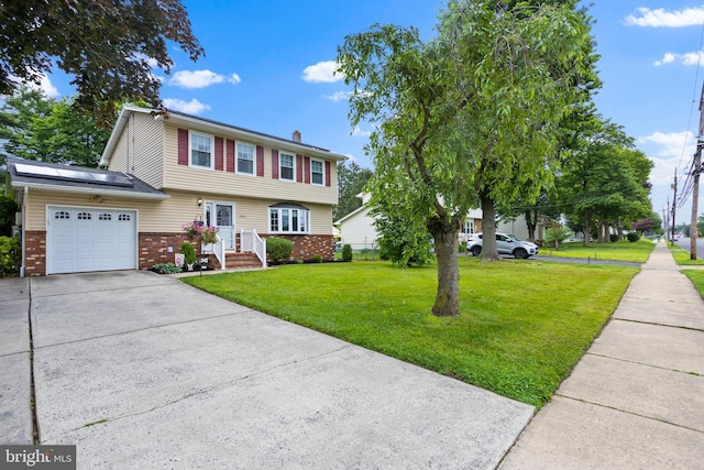 2028 S Olden Ave, Hamilton, NJ 08610 - colonial-style house featuring a garage, brick siding, driveway, a front lawn, and a chimney