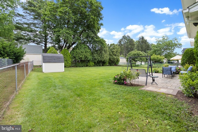 2028 S Olden Ave, Hamilton, NJ 08610 - fenced backyard with a patio and a storage unit