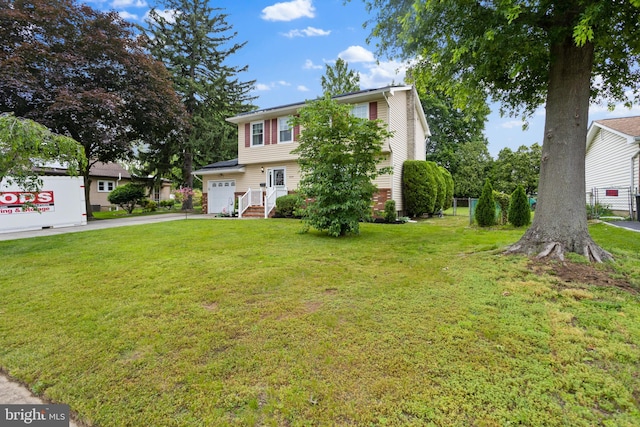 2028 S Olden Ave, Hamilton, NJ 08610 - colonial home with driveway, a front lawn, and a garage