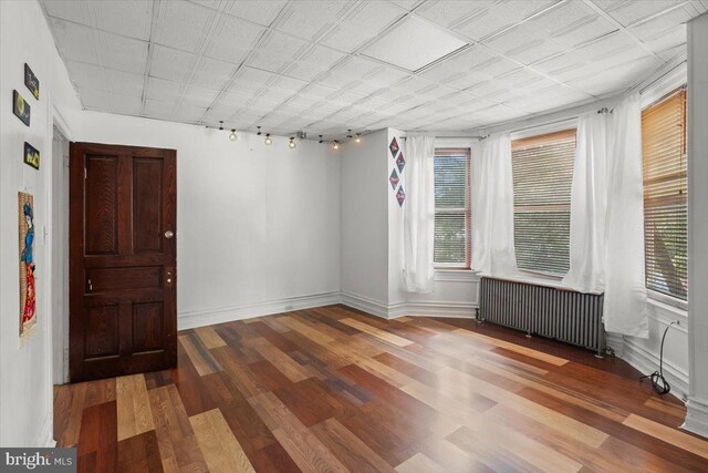 609 E Chestnut St, Lancaster, PA 17603 - unfurnished room with radiator, healthy amount of natural light, and wood finished floors
