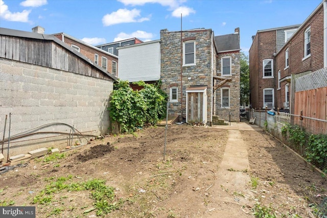 609 E Chestnut St, Lancaster, PA 17603 - rear view of property featuring stone siding