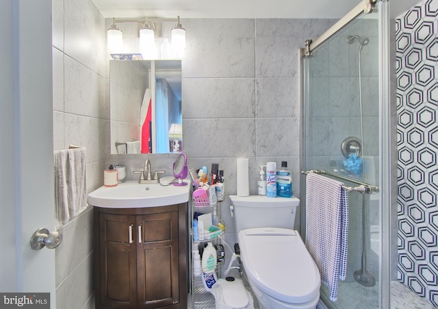 12 Stonehenge Cir Unit 12-5, Baltimore, MD 21208 - bathroom with tile walls, vanity, and a shower stall