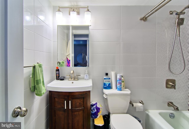 12 Stonehenge Cir Unit 12-5, Baltimore, MD 21208 - full bathroom featuring tile walls, vanity, and bathing tub / shower combination