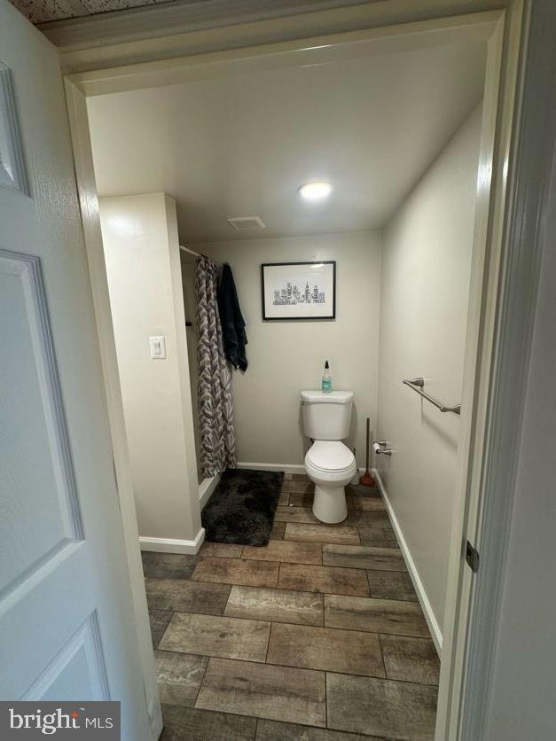 3430 Eden St, Philadelphia, PA 19114 - full bath with wood finished floors and a shower with curtain