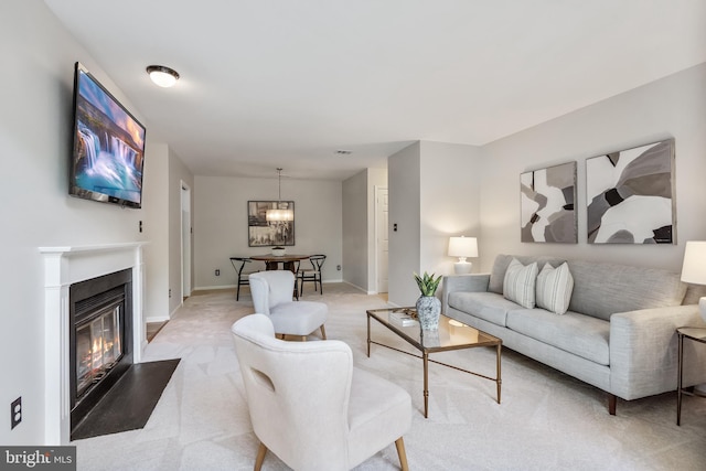 2810 Lee Oaks Pl Unit 302, Falls Church, VA 22046 - living area featuring light carpet, a chandelier, and a glass covered fireplace
