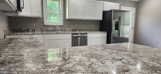 LOT664 Old Oak Ln, Front Royal, VA 22630 - kitchen featuring appliances with stainless steel finishes, light stone counters, and white cabinetry