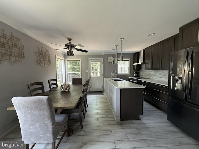 2737 Willits Rd, Philadelphia, PA 19114 - kitchen featuring black refrigerator with ice dispenser, light countertops, ceiling fan, backsplash, and dark brown cabinetry