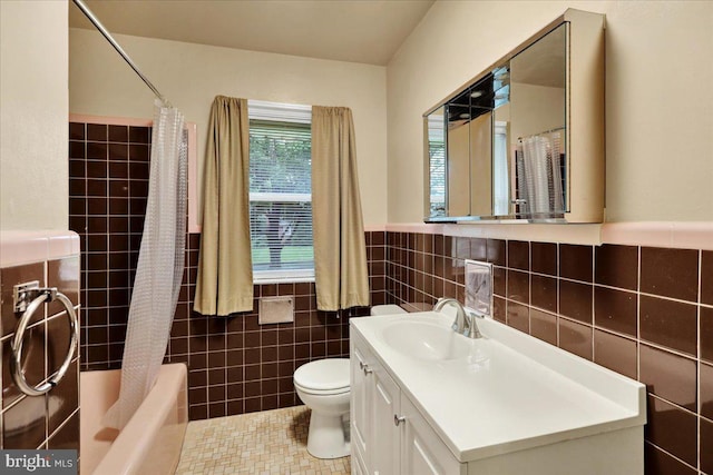 3225 Eisenbrown Rd, Reading, PA 19605 - full bathroom with tile walls, vanity, shower / tub combo with curtain, a wainscoted wall, and tile patterned flooring