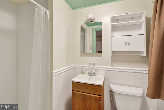 3225 Eisenbrown Rd, Reading, PA 19605 - bathroom featuring vanity, a wainscoted wall, and tile walls