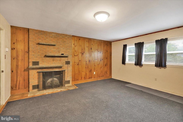 3225 Eisenbrown Rd, Reading, PA 19605 - unfurnished living room featuring wooden walls, a fireplace, and carpet floors