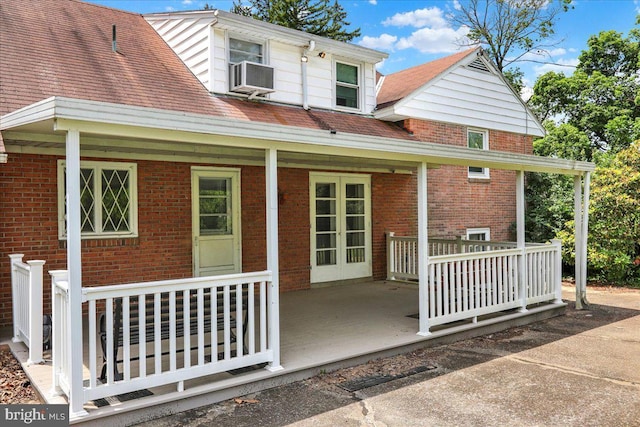 3225 Eisenbrown Rd, Reading, PA 19605 - rear view of house featuring brick siding, a porch, and cooling unit