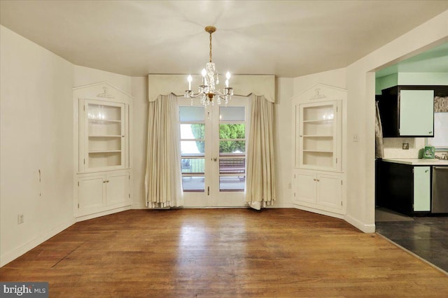 3225 Eisenbrown Rd, Reading, PA 19605 - unfurnished dining area featuring a chandelier, dark wood-style flooring, and built in features