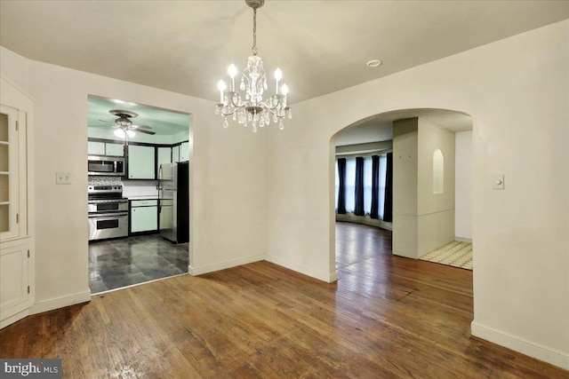 3225 Eisenbrown Rd, Reading, PA 19605 - unfurnished dining area with arched walkways, dark wood-style flooring, a ceiling fan, and a chandelier