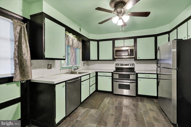 3225 Eisenbrown Rd, Reading, PA 19605 - kitchen featuring stainless steel appliances, light countertops, a ceiling fan, and tasteful backsplash