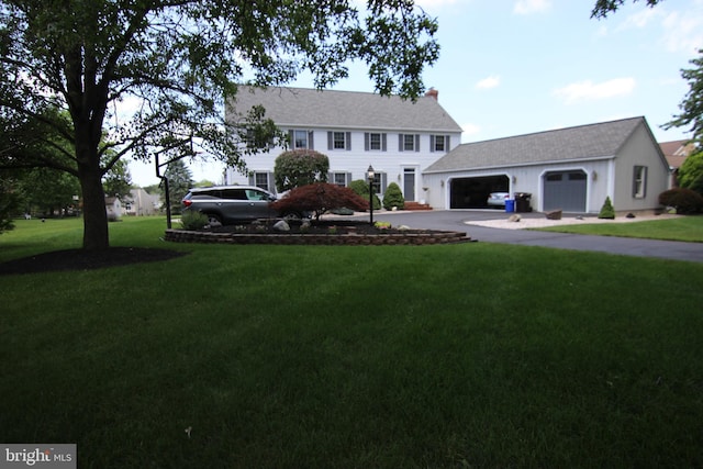 530 Station Rd, Quakertown, PA 18951 - colonial home featuring concrete driveway, a front lawn, and a chimney