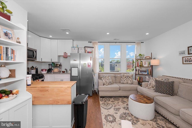 211 Webster St NE, Washington, DC 20011 - living area with wood finished floors and recessed lighting