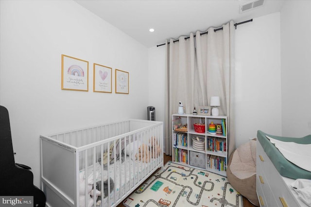 211 Webster St NE, Washington, DC 20011 - bedroom with a nursery area and recessed lighting