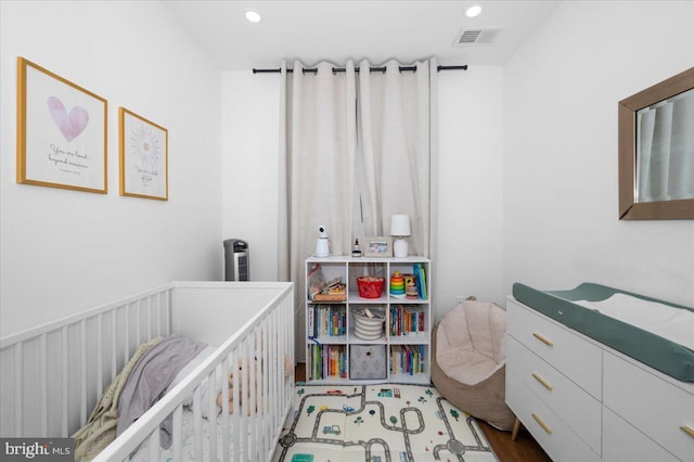 211 Webster St NE, Washington, DC 20011 - bedroom with a crib and recessed lighting