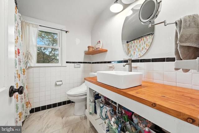1900 Philadelphia Pike, Claymont, DE 19703 - full bath featuring tile walls, a wainscoted wall, vanity, and marble finish floors
