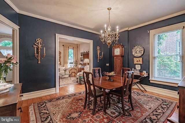407 N 8th St, Allentown, PA 18102 - dining area with wood-type flooring, a chandelier, and crown molding