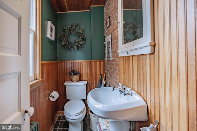 407 N 8th St, Allentown, PA 18102 - half bathroom with wood walls, tile patterned flooring, wooden ceiling, wainscoting, and radiator heating unit