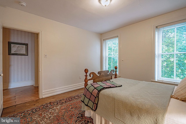 407 N 8th St, Allentown, PA 18102 - bedroom featuring wood finished floors and multiple windows