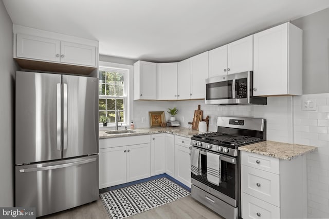 199 Erial, Pine Hill, NJ 08021 - kitchen with stainless steel appliances, white cabinets, and light wood-style floors