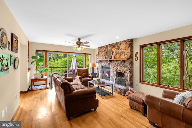 210 Providence Rd, Annapolis, MD 21409 - living area featuring light wood-style floors, a fireplace, and a ceiling fan