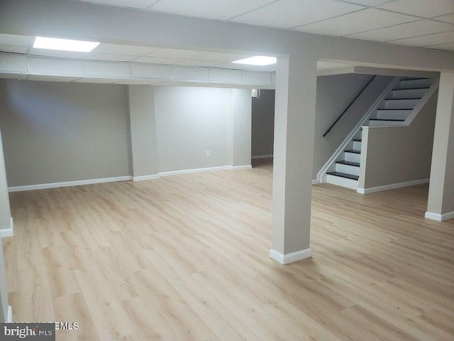 57 Turnberry Cir, Toms River, NJ 08753 - finished basement featuring a paneled ceiling, stairs, and wood finished floors