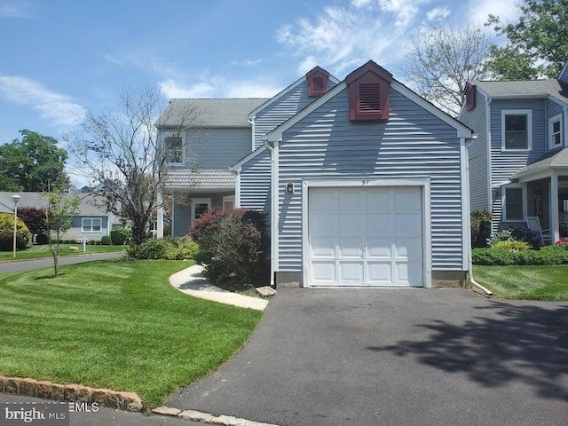 57 Turnberry Cir, Toms River, NJ 08753 - view of front of house with an attached garage, asphalt driveway, and a front lawn
