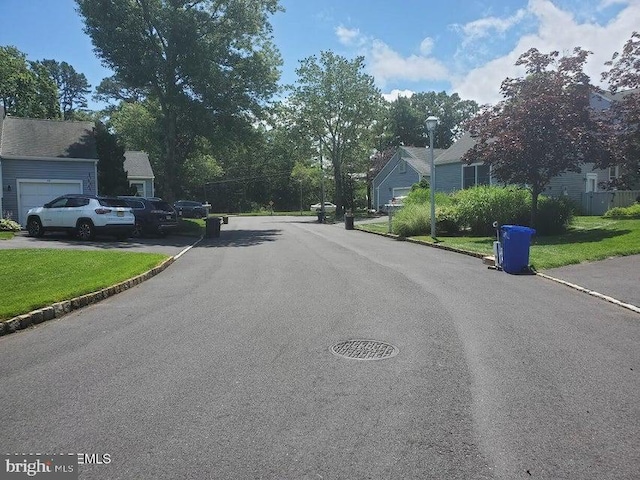57 Turnberry Cir, Toms River, NJ 08753 - view of asphalt street with street lights, curbs, and a residential view